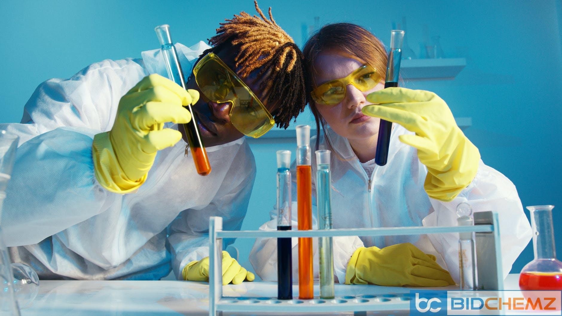 a man and a woman holding a test tube