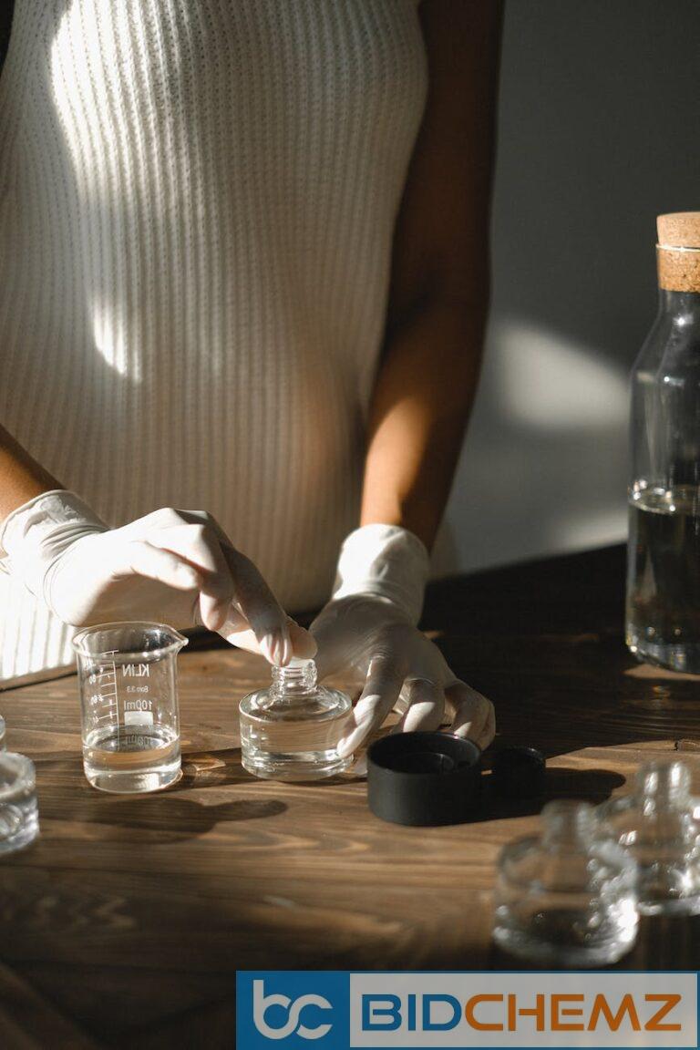 unrecognizable woman making liquid incense