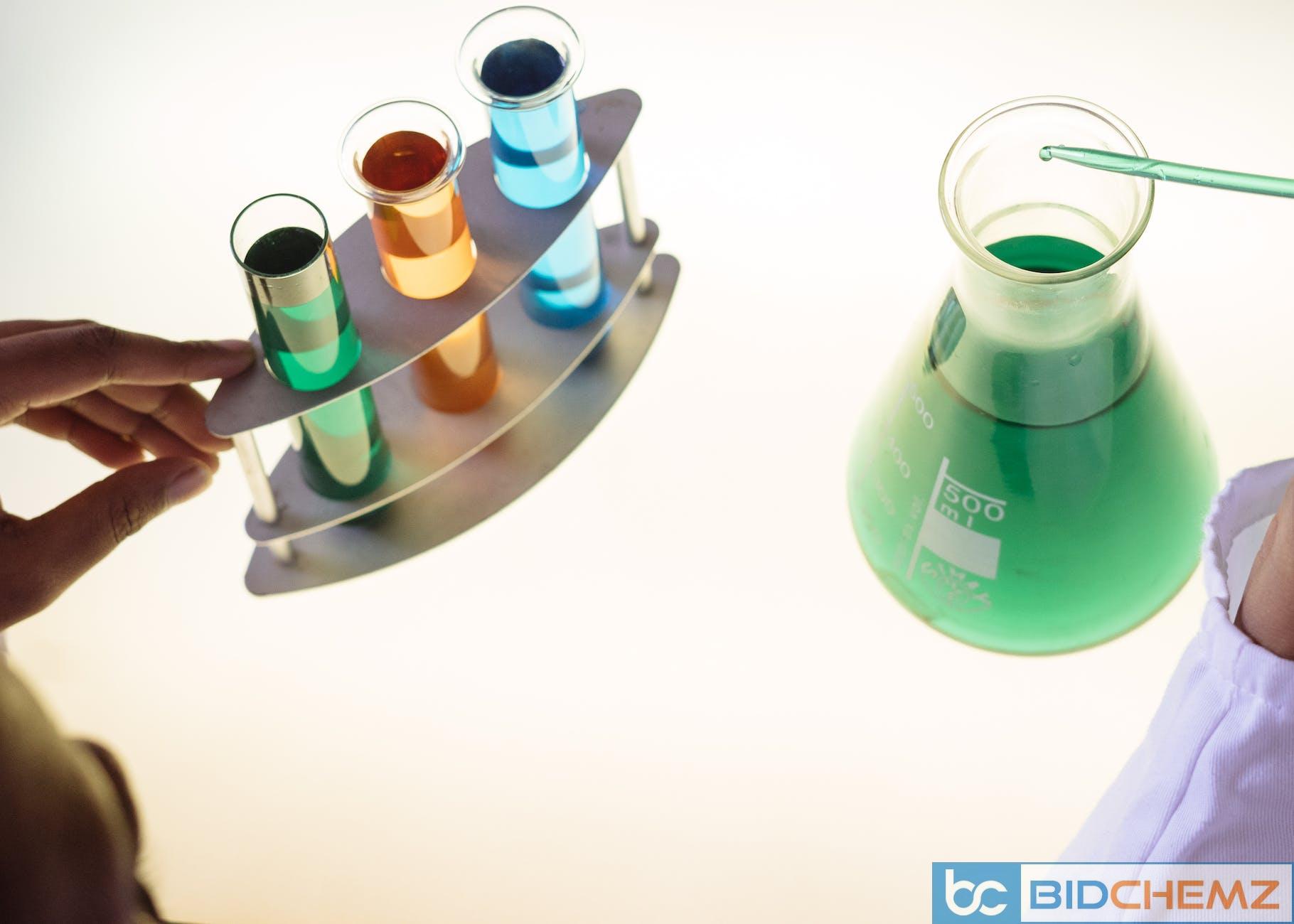 crop laboratory technician examining interaction of chemicals in practical test modern lab